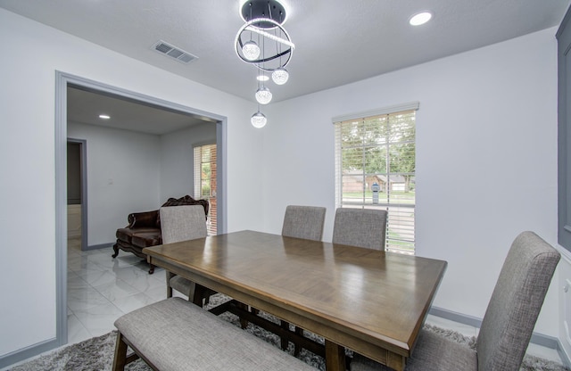 15014 Carol Chase Cir, Houston, TX 77489 - dining room featuring light marble finish flooring, plenty of natural light, baseboards, and recessed lighting