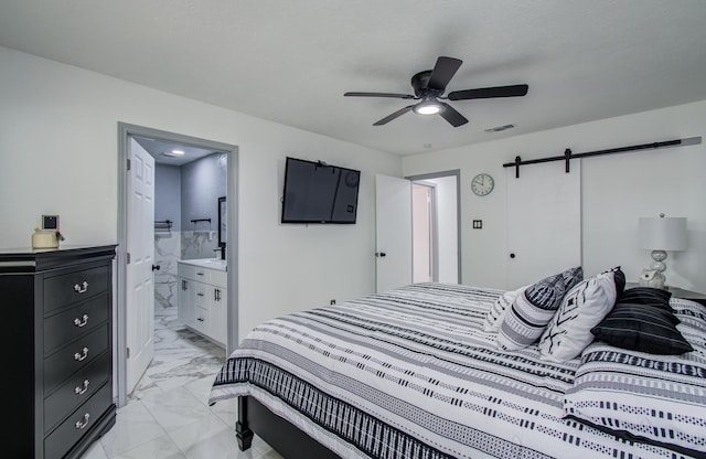 15014 Carol Chase Cir, Houston, TX 77489 - bedroom with light marble finish floors, a barn door, a ceiling fan, and ensuite bathroom
