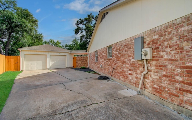 15014 Carol Chase Cir, Houston, TX 77489 - view of home's exterior featuring brick siding, an outbuilding, and concrete driveway