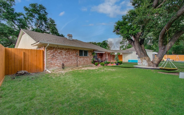 15014 Carol Chase Cir, Houston, TX 77489 - back of house with a chimney and brick siding