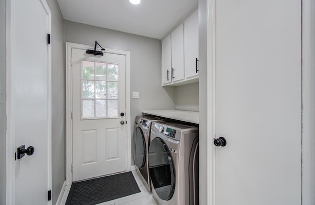 15014 Carol Chase Cir, Houston, TX 77489 - laundry area featuring cabinet space, washer and dryer, and tile patterned floors
