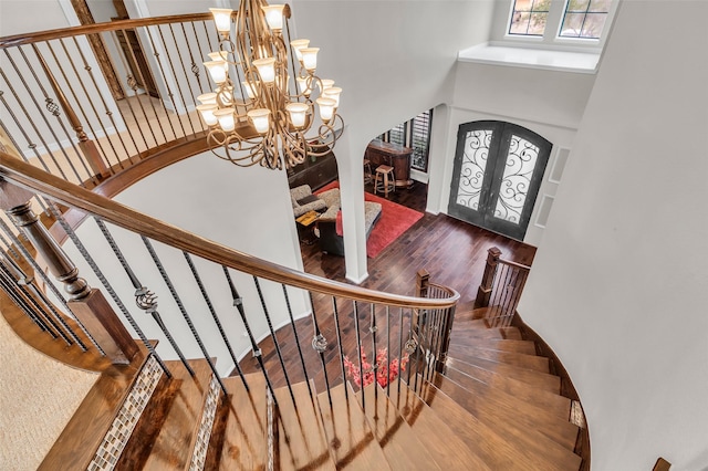 5306 Lockwood Bend Ln, Sugar Land, TX 77479 - entrance foyer featuring a towering ceiling, wood finished floors, plenty of natural light, a chandelier, and stairway