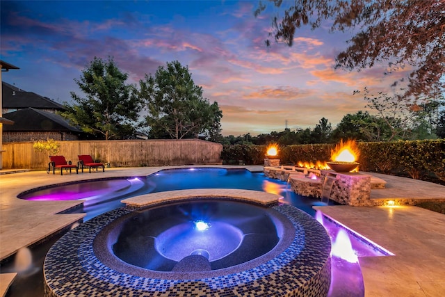 5306 Lockwood Bend Ln, Sugar Land, TX 77479 - view of pool with a fire pit, a patio, and a pool with connected hot tub