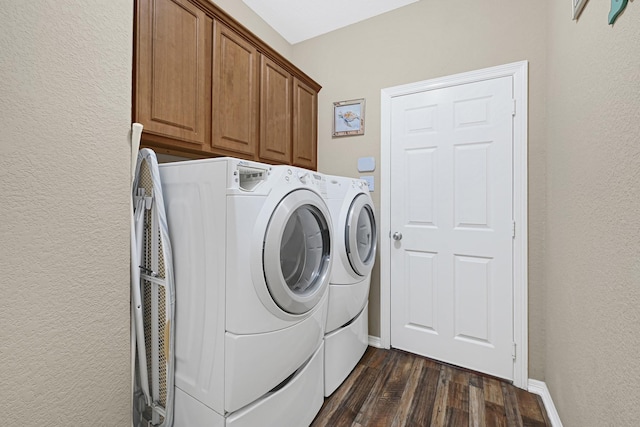 3518 Bain St, Houston, TX 77026 - laundry area with washer and dryer, a textured wall, cabinet space, dark wood-style floors, and baseboards