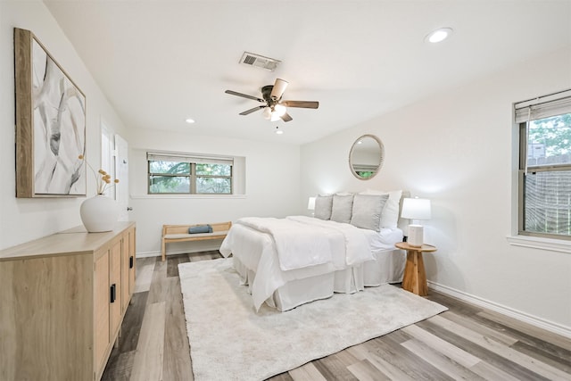 6315 Amie Ln Unit Cr879, Pearland, TX 77584 - bedroom with light wood-style flooring, baseboards, recessed lighting, and a ceiling fan