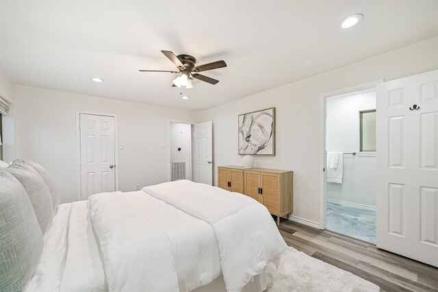 6315 Amie Ln Unit Cr879, Pearland, TX 77584 - bedroom with light wood-style floors, recessed lighting, ensuite bath, ceiling fan, and baseboards