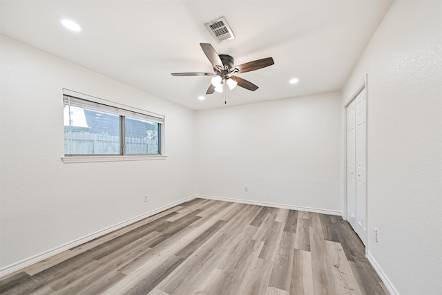 6315 Amie Ln Unit Cr879, Pearland, TX 77584 - unfurnished bedroom featuring wood finished floors, recessed lighting, a closet, a ceiling fan, and baseboards