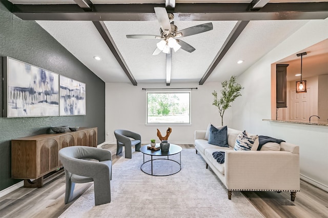 6315 Amie Ln Unit Cr879, Pearland, TX 77584 - living area featuring wood finished floors, baseboards, recessed lighting, a ceiling fan, and a textured ceiling