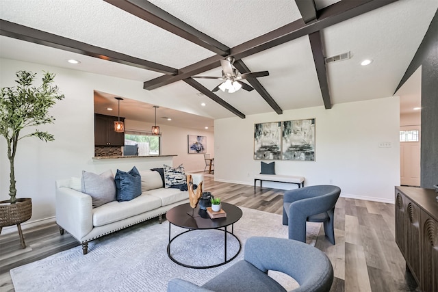 6315 Amie Ln Unit Cr879, Pearland, TX 77584 - living area featuring light wood-style floors, recessed lighting, ceiling fan, baseboards, and a textured ceiling