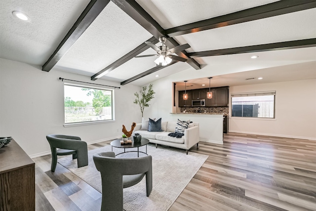 6315 Amie Ln Unit Cr879, Pearland, TX 77584 - living area featuring recessed lighting, a ceiling fan, light wood-style flooring, baseboards, and a textured ceiling