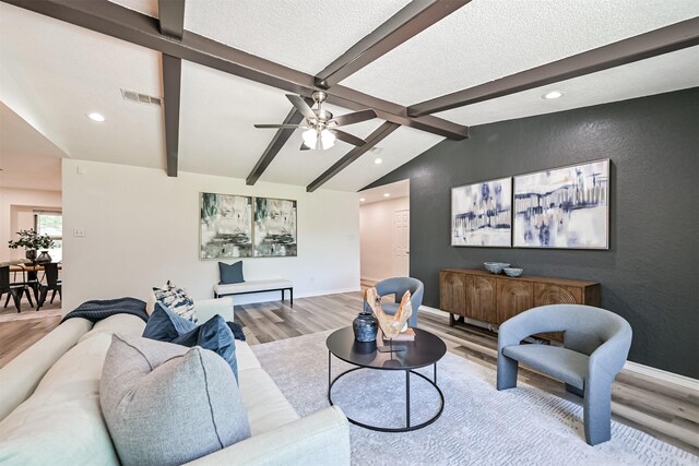 6315 Amie Ln Unit Cr879, Pearland, TX 77584 - living area featuring light wood-type flooring, recessed lighting, ceiling fan, baseboards, and a textured ceiling