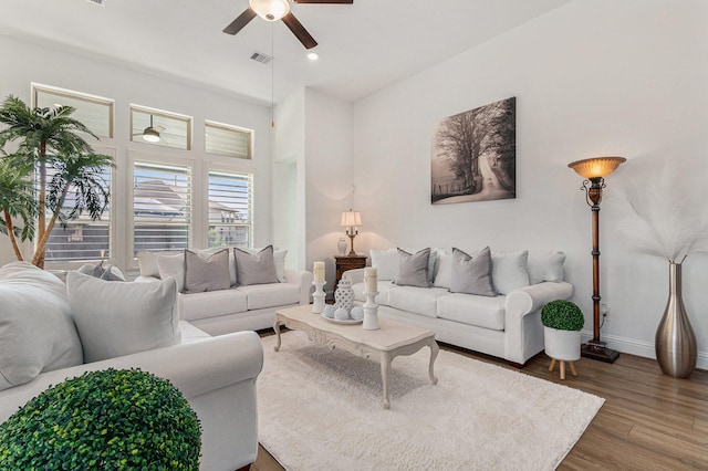 1059 Lakemont Bend Ln, Pinehurst, TX 77362 - living area featuring a ceiling fan, baseboards, wood finished floors, and recessed lighting