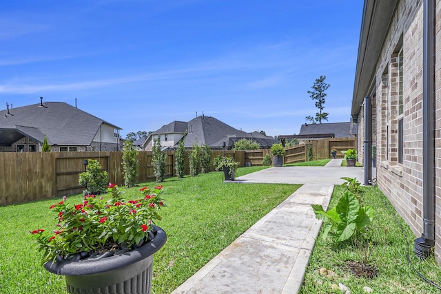 1059 Lakemont Bend Ln, Pinehurst, TX 77362 - view of yard featuring a patio and a residential view