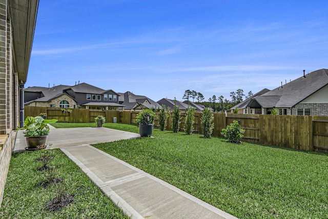 1059 Lakemont Bend Ln, Pinehurst, TX 77362 - view of yard with a patio area and a residential view