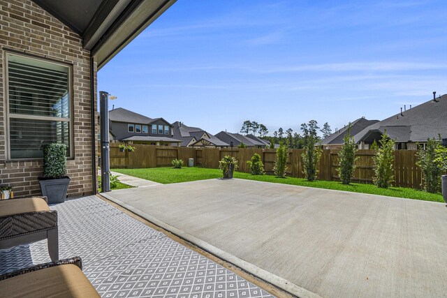 1059 Lakemont Bend Ln, Pinehurst, TX 77362 - view of patio / terrace featuring a residential view