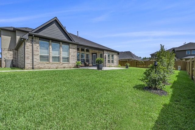1059 Lakemont Bend Ln, Pinehurst, TX 77362 - back of property with brick siding and a patio