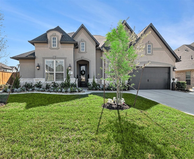 1059 Lakemont Bend Ln, Pinehurst, TX 77362 - french country home with stucco siding, concrete driveway, and roof with shingles