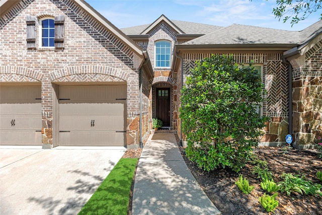 15019 Turquoise Mist Dr, Cypress, TX 77433 - french country style house with brick siding, driveway, and roof with shingles