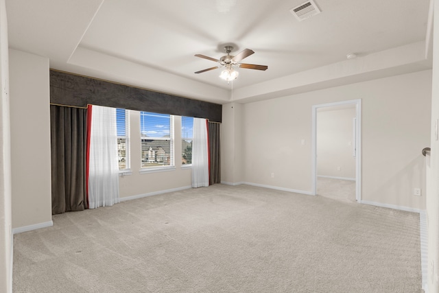 7603 Millstone Trail Ln, Richmond, TX 77469 - unfurnished room featuring a tray ceiling, a ceiling fan, light carpet, and baseboards