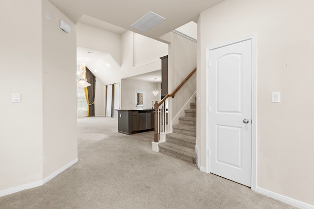 7603 Millstone Trail Ln, Richmond, TX 77469 - foyer entrance with light colored carpet, stairway, and baseboards