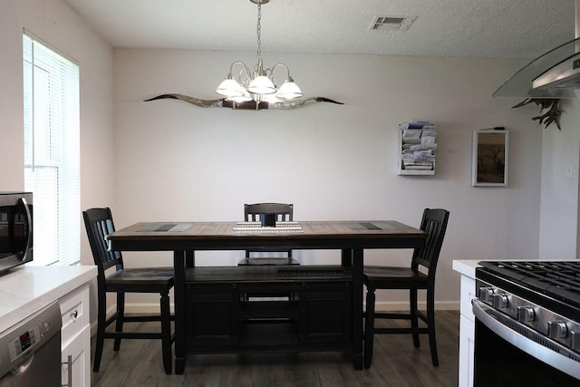 13911 W Richmond St, Needville, TX 77461 - dining area with healthy amount of natural light, a chandelier, dark wood-style flooring, and baseboards