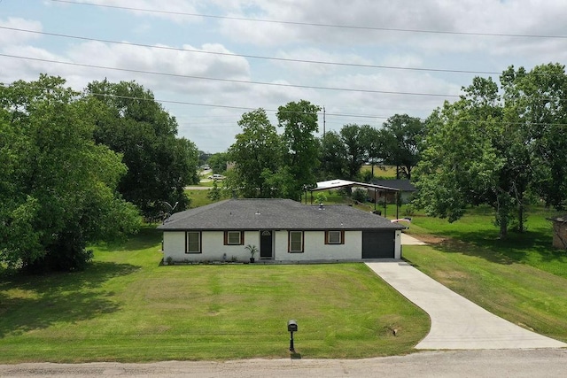 13911 W Richmond St, Needville, TX 77461 - view of front of home with concrete driveway, a front lawn, and a garage