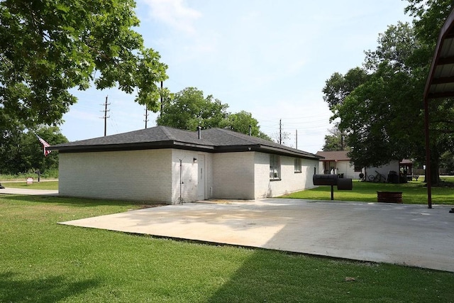 13911 W Richmond St, Needville, TX 77461 - rear view of property featuring a yard and a patio area