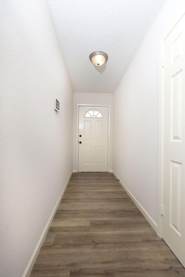 13911 W Richmond St, Needville, TX 77461 - entryway with baseboards and wood finished floors
