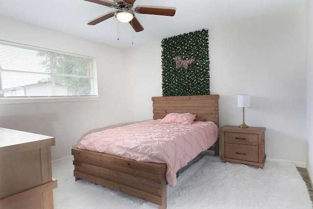 13911 W Richmond St, Needville, TX 77461 - carpeted bedroom with baseboards and ceiling fan