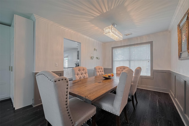 18206 Lake Bend Dr, Houston, TX 77084 - dining room featuring dark wood-type flooring, ornamental molding, and a wainscoted wall