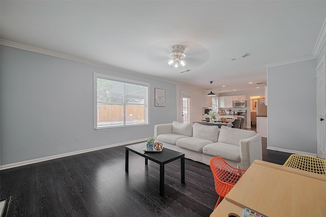 18206 Lake Bend Dr, Houston, TX 77084 - living room with ornamental molding, ceiling fan, baseboards, dark wood-type flooring, and plenty of natural light