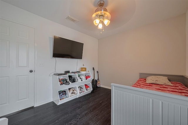 18206 Lake Bend Dr, Houston, TX 77084 - bedroom with dark wood-style floors, baseboards, and a ceiling fan