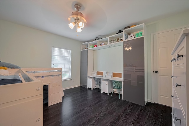 18206 Lake Bend Dr, Houston, TX 77084 - bedroom with dark wood-style floors, a desk, and baseboards