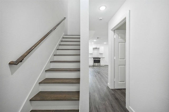 2310 Wavell St, Houston, TX 77088 - stairs featuring wood finished floors and recessed lighting