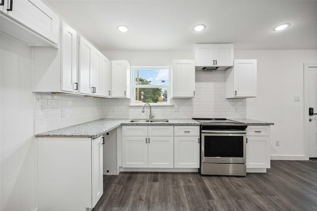 2310 Wavell St, Houston, TX 77088 - kitchen with electric stove, a sink, dark wood finished floors, white cabinets, and recessed lighting