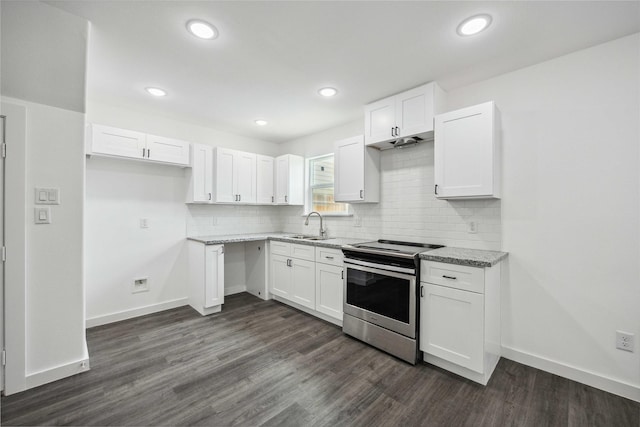 2310 Wavell St, Houston, TX 77088 - kitchen featuring stainless steel electric range, white cabinets, a sink, and recessed lighting