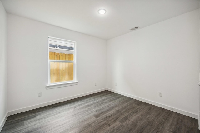 2310 Wavell St, Houston, TX 77088 - empty room with dark wood-type flooring, baseboards, and recessed lighting