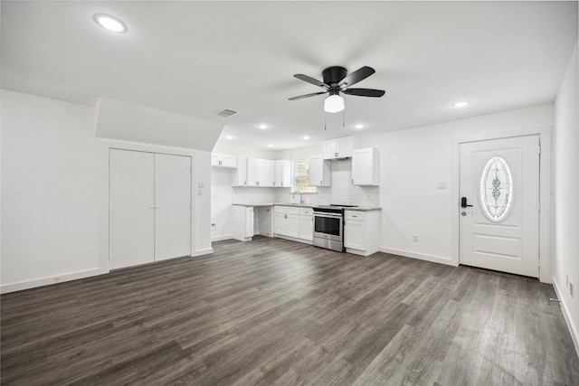 2310 Wavell St, Houston, TX 77088 - unfurnished living room featuring a sink, dark wood-style flooring, a ceiling fan, recessed lighting, and baseboards