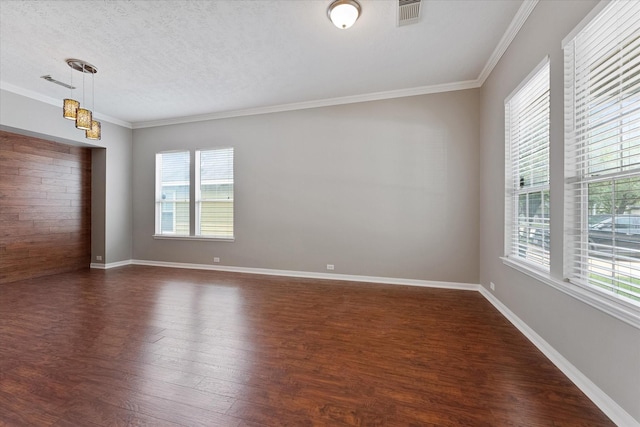 12714 Benton Park Ln, Tomball, TX 77377 - unfurnished room with healthy amount of natural light, dark wood finished floors, ornamental molding, baseboards, and a textured ceiling