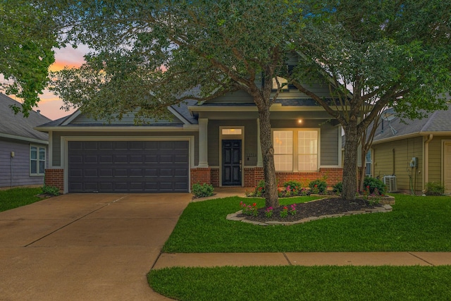 12714 Benton Park Ln, Tomball, TX 77377 - view of front of home with brick siding, driveway, and a garage