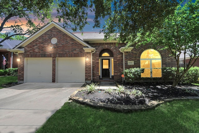 8910 Burleson Ct, Houston, TX 77064 - view of front of house featuring an attached garage, brick siding, and driveway
