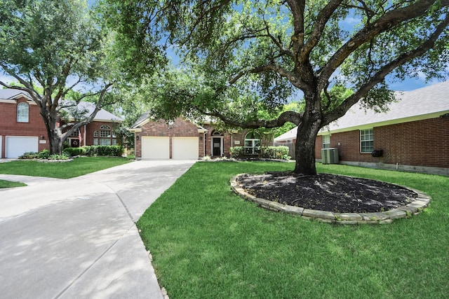 8910 Burleson Ct, Houston, TX 77064 - view of front facade featuring a garage, a front lawn, and brick siding