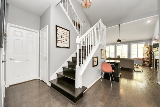 8910 Burleson Ct, Houston, TX 77064 - stairs featuring a ceiling fan, wood-type flooring, recessed lighting, baseboards, and a chandelier
