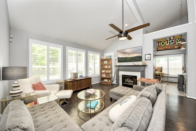 8910 Burleson Ct, Houston, TX 77064 - living area featuring ceiling fan, dark wood-style flooring, a tiled fireplace, high vaulted ceiling, and baseboards