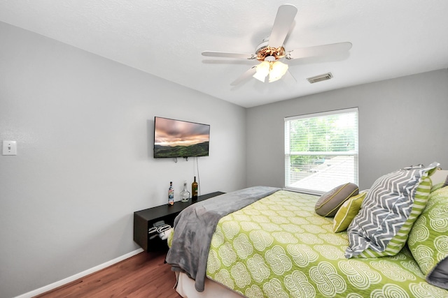 8910 Burleson Ct, Houston, TX 77064 - bedroom featuring wood finished floors, baseboards, and ceiling fan