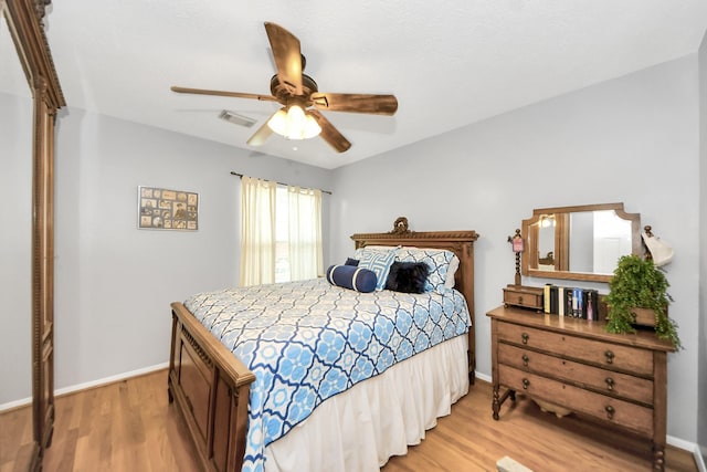 8910 Burleson Ct, Houston, TX 77064 - bedroom with light wood-style floors, baseboards, and ceiling fan