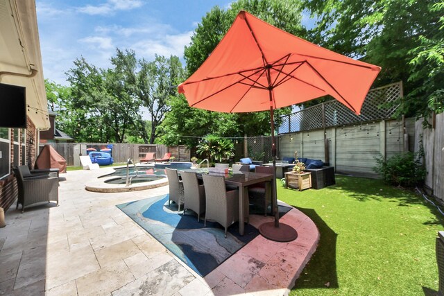 8910 Burleson Ct, Houston, TX 77064 - view of patio / terrace with an in-ground hot tub