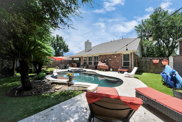 8910 Burleson Ct, Houston, TX 77064 - view of swimming pool featuring a patio area and a pool with connected hot tub