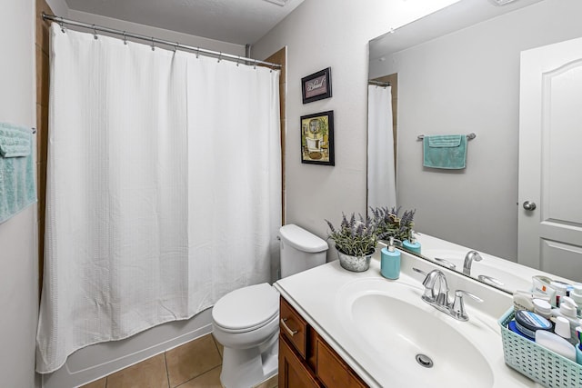 5306 Brookway Dr, Houston, TX 77084 - bathroom featuring vanity, toilet, tile patterned floors, and shower / bathtub combination with curtain