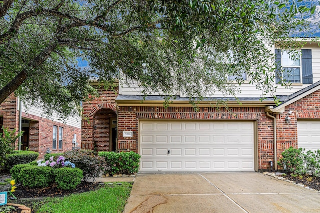 5306 Brookway Dr, Houston, TX 77084 - view of front of house with brick siding, concrete driveway, and an attached garage